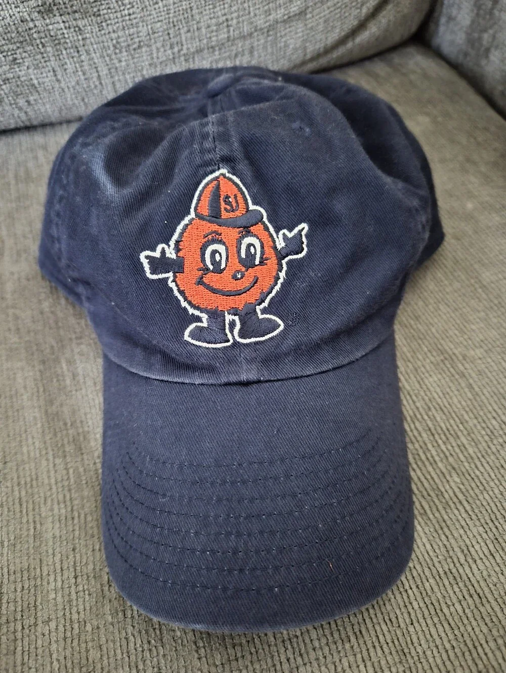 This NIKE Syracuse University Navy Cap with Orange Mascot and Red Swoosh